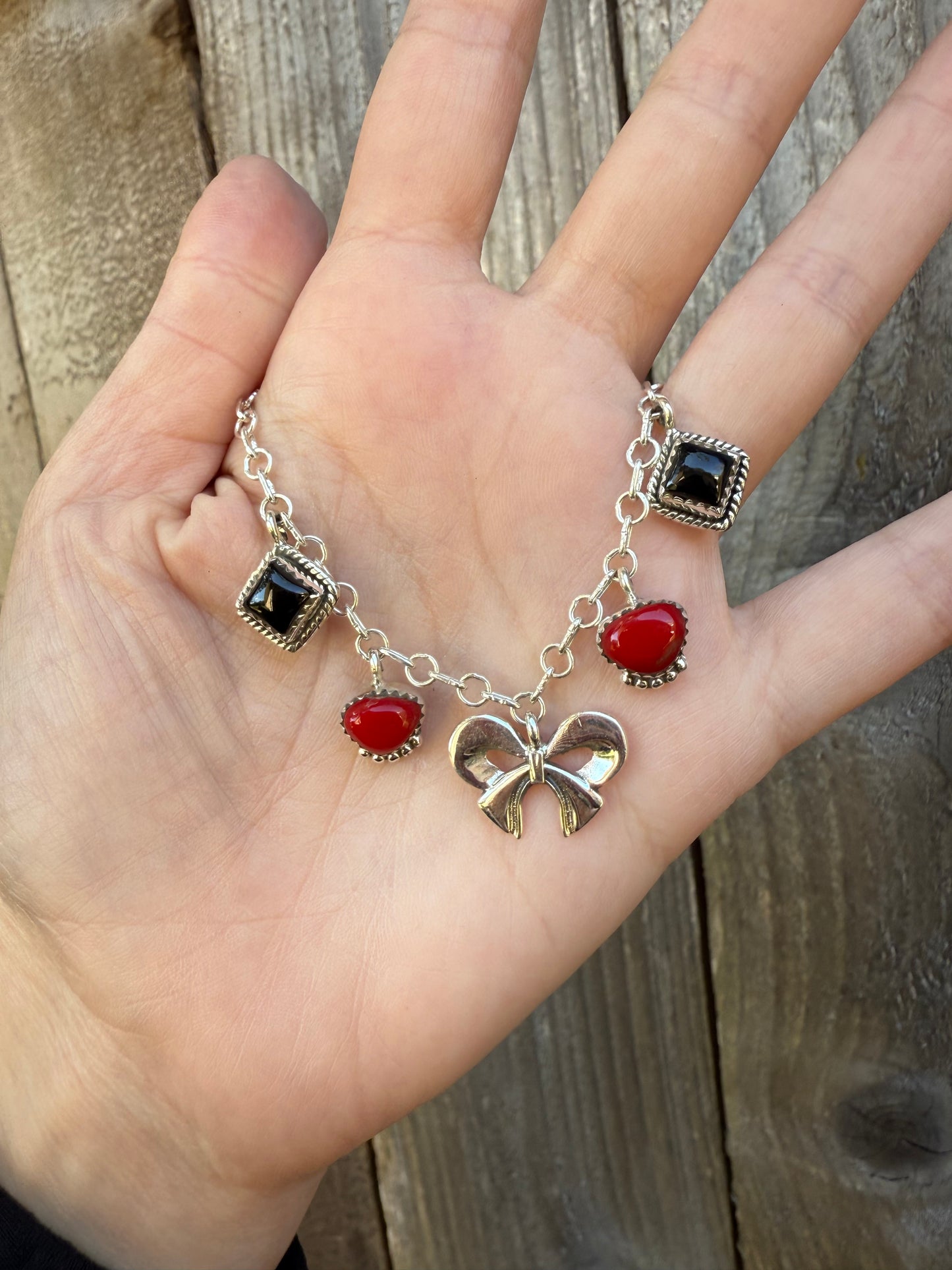 Red Rosarita and Black Onyx Bow Sterling Silver Charm Necklace